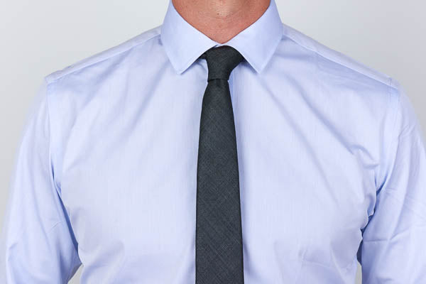 semi spread collar with tie on a men's dress shirt