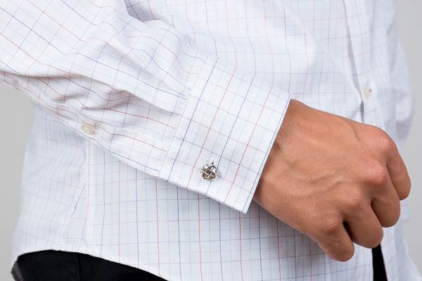 barrel cuff worn with a cufflink on a men's cotton dress shirt